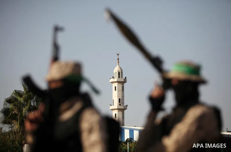 Palestinian militants of the Hamas movement take part in a rally in Gaza city on November 25, 2016. Photo by Ashraf Amra
