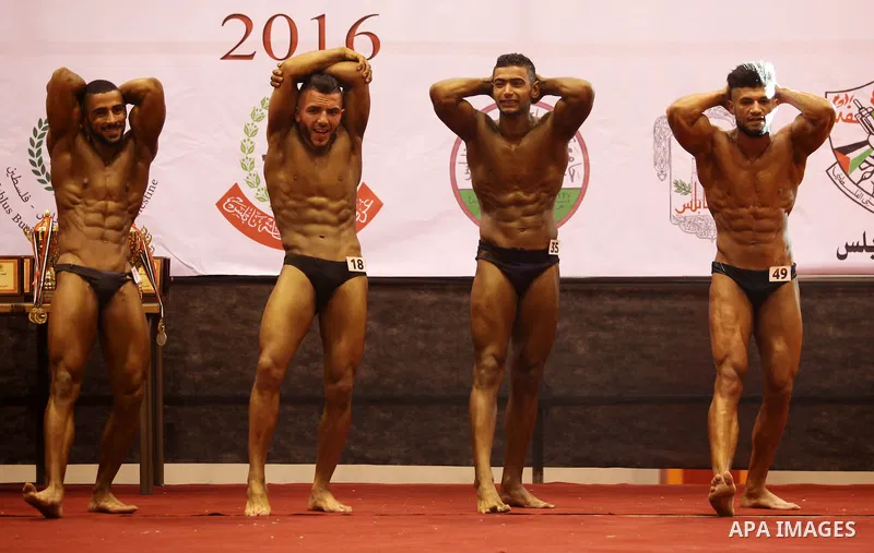 Palestinian participants pose during a bodybuilding competition in the West Bank city of Nablus November 25, 2016. Photo by Nedal Eshtayah