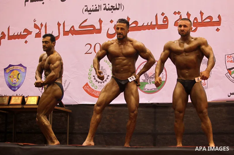 Palestinian participants pose during a bodybuilding competition in the West Bank city of Nablus November 25, 2016. Photo by Nedal Eshtayah