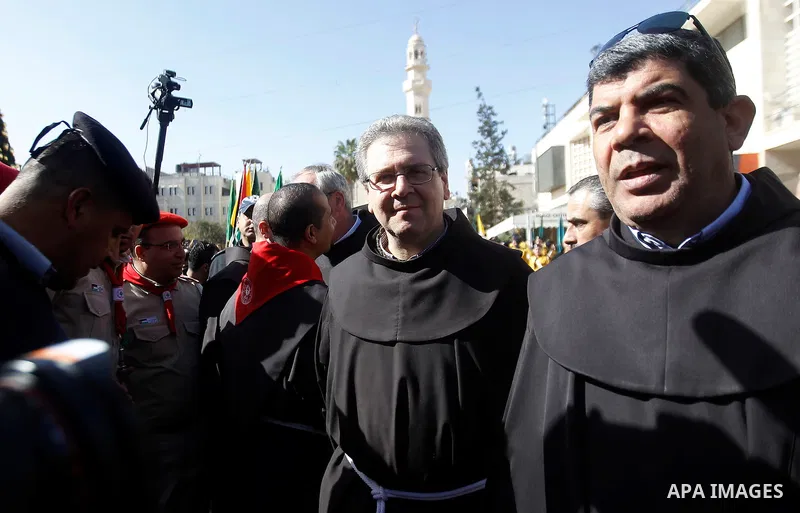 Custodian of the Holy Land Father Francesco Patton arrives to the church of Nativity to ceremonially launch the beginning of the Christmas season, in the West Bank city of Bethlehem November 26, 2016. Photo by Wisam Hash...