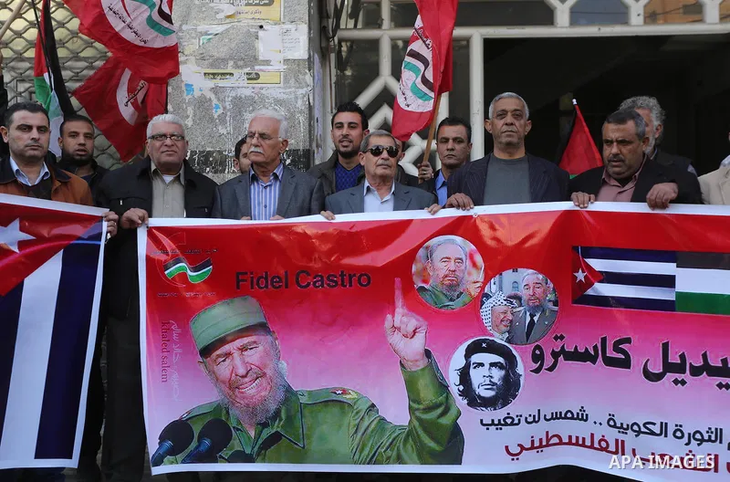 Palestinian supporters of Palestinian People's Party take part in a rally to solidarity with of Cuban historic revolutionary leader Fidel Castro after his death, in Gaza city 27, 2016. Cuban revolutionary icon Fidel Cast...