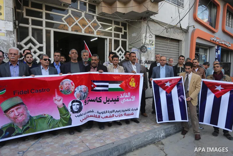 Palestinian supporters of Palestinian People's Party take part in a rally to solidarity with of Cuban historic revolutionary leader Fidel Castro after his death, in Gaza city 27, 2016. Cuban revolutionary icon Fidel Cast...