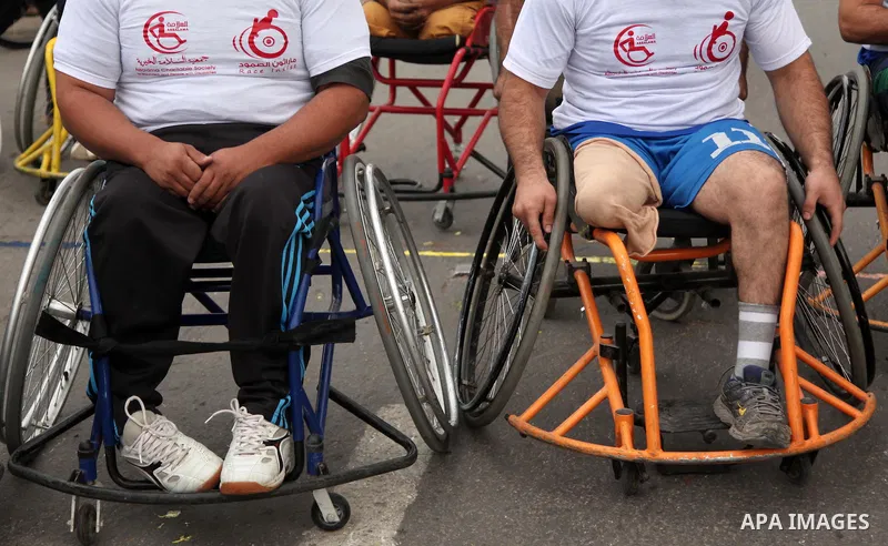 Palestinian men on wheelchairs to compete in a marathon organized for the Palestinians who have been wounded as a result of wars, in the November 29, 2016 in Gaza City. Tens of thousands of Gaza residents are learning to...