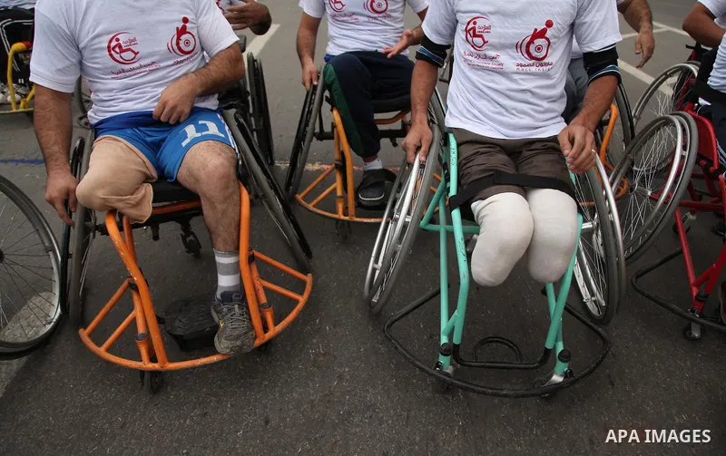 Palestinian men on wheelchairs to compete in a marathon organized for the Palestinians who have been wounded as a result of wars, in the November 29, 2016 in Gaza City. Tens of thousands of Gaza residents are learning to...