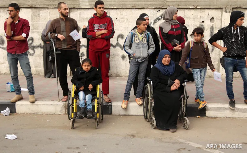 Palestinian men on wheelchairs to compete in a marathon organized for the Palestinians who have been wounded as a result of wars, in the November 29, 2016 in Gaza City. Tens of thousands of Gaza residents are learning to...