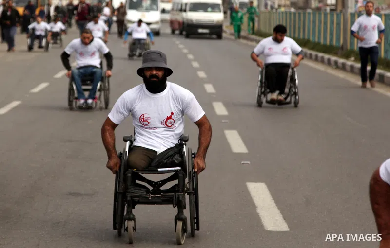 Palestinian men on wheelchairs to compete in a marathon organized for the Palestinians who have been wounded as a result of wars, in the November 29, 2016 in Gaza City. Tens of thousands of Gaza residents are learning to...