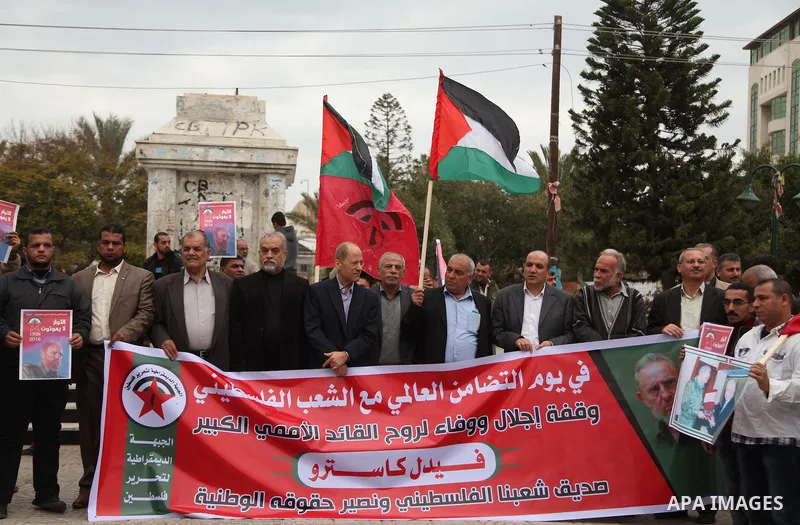 Palestinians hold posters of late Cuban leader Fidel Castro during a gathering in Gaza city on November 29, 2016 to pay tribute him after his death. Cuban revolutionary icon Fidel Castro died late November 25 in Havana,...
