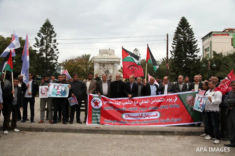Palestinians hold posters of late Cuban leader Fidel Castro during a gathering in Gaza city on November 29, 2016 to pay tribute him after his death. Cuban revolutionary icon Fidel Castro died late November 25 in Havana,...