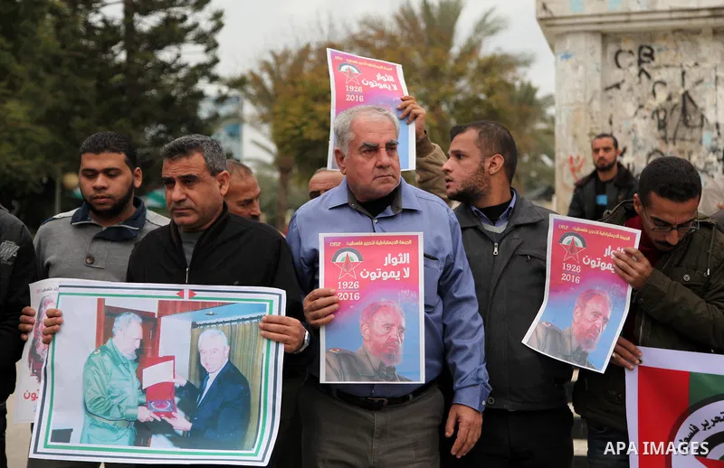 Palestinians hold posters of late Cuban leader Fidel Castro during a gathering in Gaza city on November 29, 2016 to pay tribute him after his death. Cuban revolutionary icon Fidel Castro died late November 25 in Havana,...