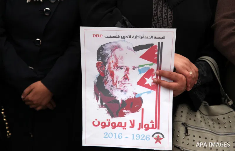 Palestinians hold posters of late Cuban leader Fidel Castro during a gathering in Gaza city on November 29, 2016 to pay tribute him after his death. Cuban revolutionary icon Fidel Castro died late November 25 in Havana,...