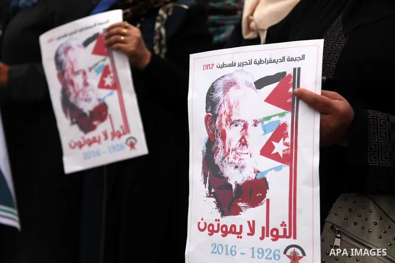 Palestinians hold posters of late Cuban leader Fidel Castro during a gathering in Gaza city on November 29, 2016 to pay tribute him after his death. Cuban revolutionary icon Fidel Castro died late November 25 in Havana,...