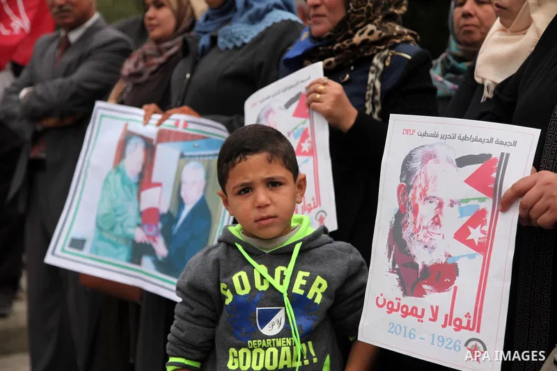 Palestinians hold posters of late Cuban leader Fidel Castro during a gathering in Gaza city on November 29, 2016 to pay tribute him after his death. Cuban revolutionary icon Fidel Castro died late November 25 in Havana,...