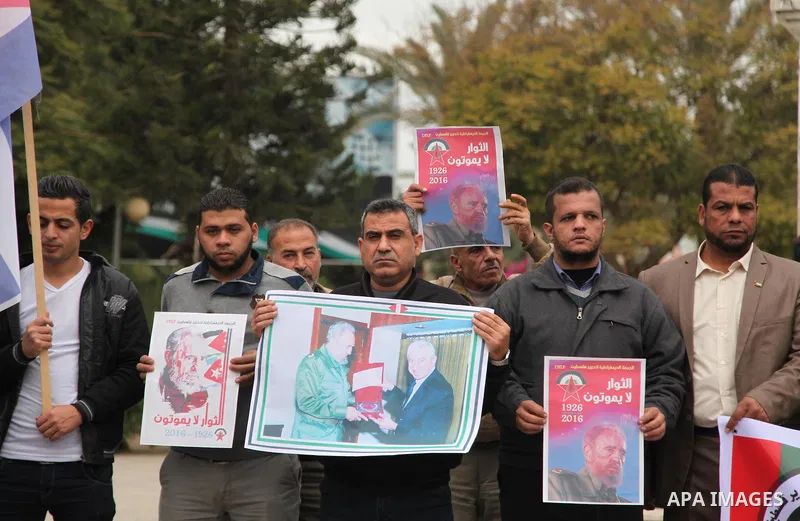 Palestinians hold posters of late Cuban leader Fidel Castro during a gathering in Gaza city on November 29, 2016 to pay tribute him after his death. Cuban revolutionary icon Fidel Castro died late November 25 in Havana,...