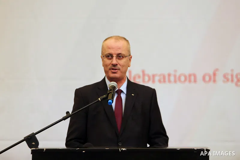 Palestinian Prime Minister Rami Hamdallah speaks during a ceremony of signing the PNIPH law, in the West Bank city of Ramallah, on Nov. 30, 2016. Photo by Prime Minister Office