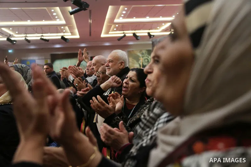 Members of the Fatah party react at the end of a speech delivered by the Palestinian president Mahmoud Abbas on the second day of the 7th Fatah Congress on November 30, 2016, at the Muqataa, the Palestinian Authority hea...