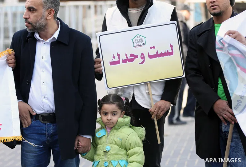 Palestinians and physically challenged people take part in a rally marking the International Day of Persons with Disabilities in Gaza City, on December 1, 2016. Photo by Yasser Qudih