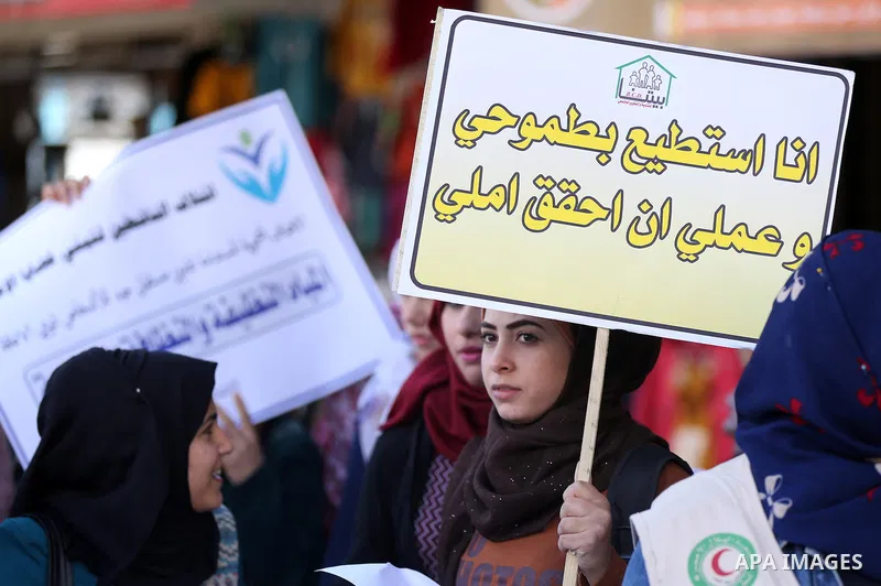 Palestinians and physically challenged people take part in a rally marking the International Day of Persons with Disabilities in Gaza City, on December 1, 2016. Photo by Yasser Qudih