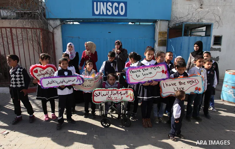 Palestinians and physically challenged people take part in a rally marking the International Day of Persons with Disabilities, outside the UNESCO headquarters in Gaza city, on December 1, 2016. Photo by Ashraf Amra