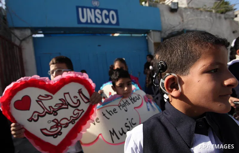 Palestinians and physically challenged people take part in a rally marking the International Day of Persons with Disabilities, outside the UNESCO headquarters in Gaza city, on December 1, 2016. Photo by Ashraf Amra