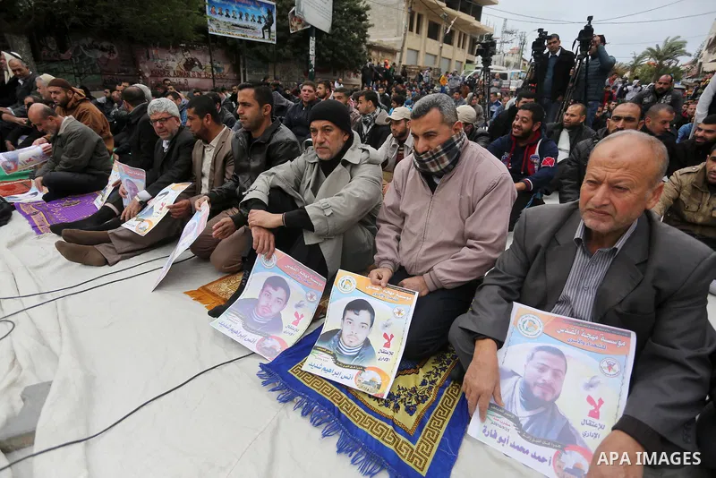 Palestinian supporters of the Islamic Jihad Movement attend Friday prayers to show solidarity with Palestinian prisoners on hunger strike in Israeli Jails, in front of Red cross office in Gaza city, on Dec. 02, 2016. Pho...