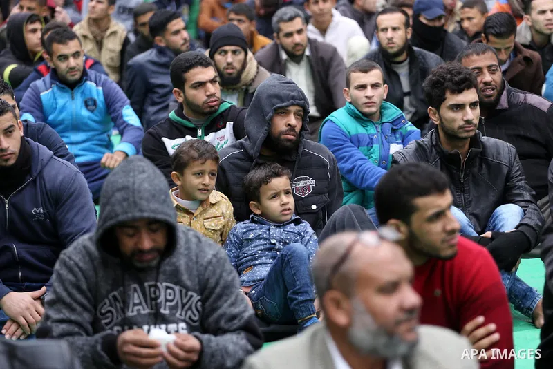 Palestinian supporters of the Islamic Jihad Movement attend Friday prayers to show solidarity with Palestinian prisoners on hunger strike in Israeli Jails, in front of Red cross office in Gaza city, on Dec. 02, 2016. Pho...