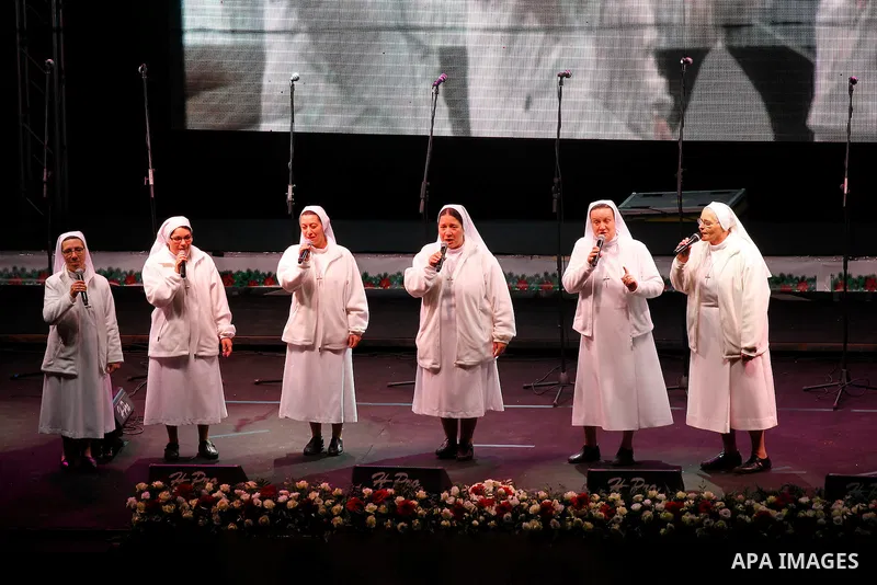 A band of nuns performs during the ceremony of lighting the Christmas tree on December 3, 2016 at the Manger Square near the Church of the Nativity, revered as the site of Jesus Christ's birth, in the biblical West Bank...