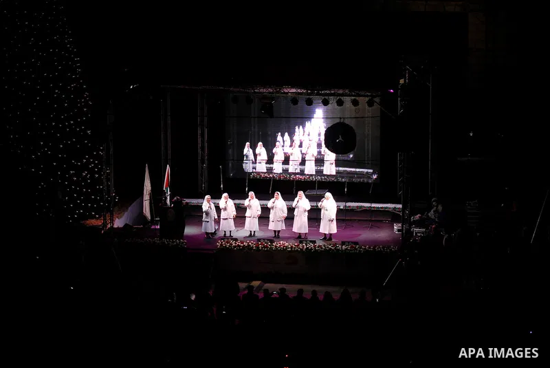 A band of nuns performs during the ceremony of lighting the Christmas tree on December 3, 2016 at the Manger Square near the Church of the Nativity, revered as the site of Jesus Christ's birth, in the biblical West Bank...