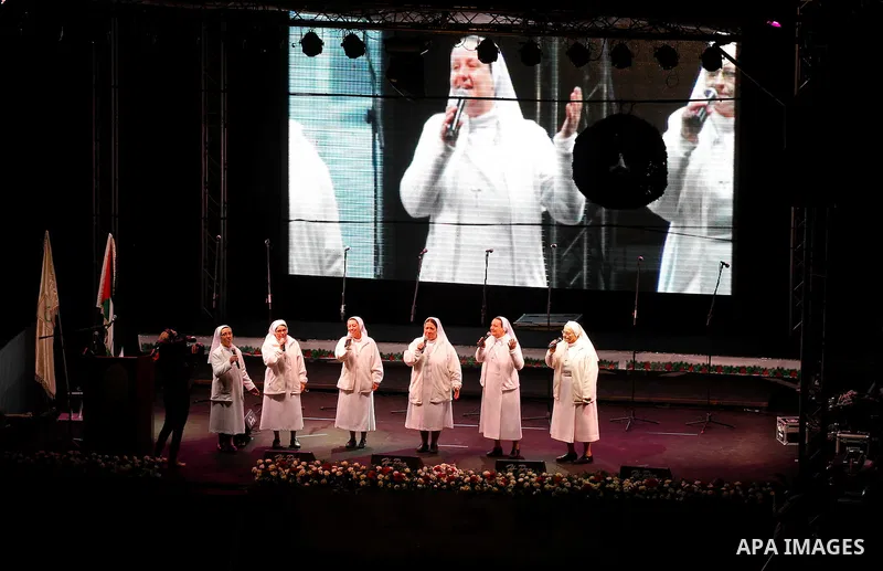 A band of nuns performs during the ceremony of lighting the Christmas tree on December 3, 2016 at the Manger Square near the Church of the Nativity, revered as the site of Jesus Christ's birth, in the biblical West Bank...