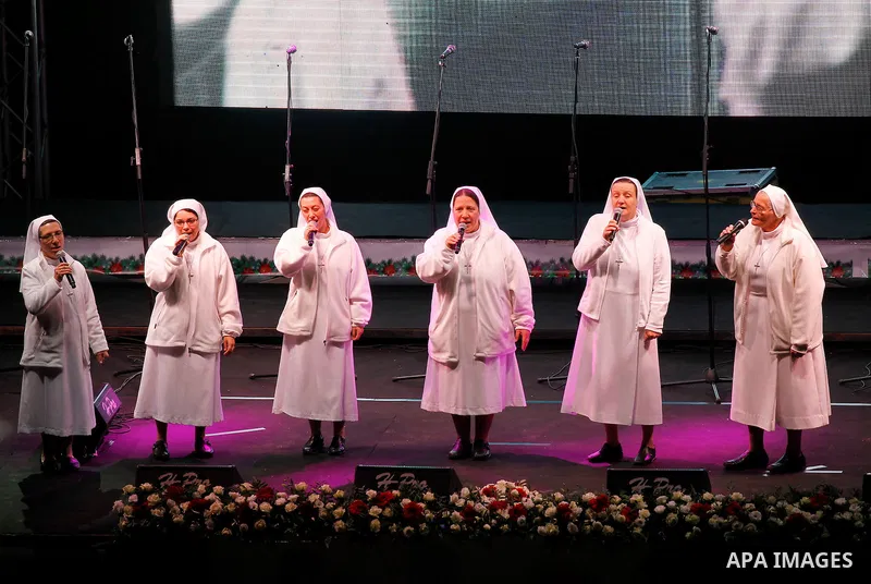 A band of nuns performs during the ceremony of lighting the Christmas tree on December 3, 2016 at the Manger Square near the Church of the Nativity, revered as the site of Jesus Christ's birth, in the biblical West Bank...