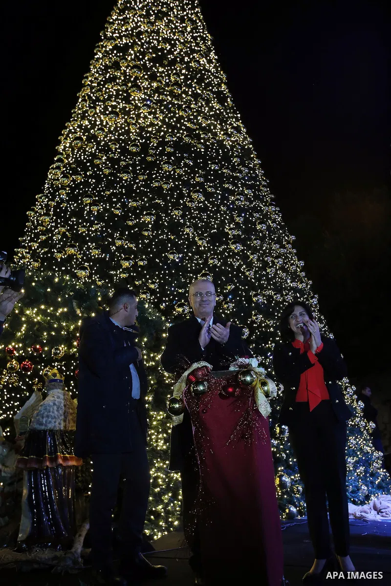 Palestinian Prime Minister, Rami Hamdallah attends the lighting of the Christmas tree on December 3, 2016 at the Manger Square near the Church of the Nativity, revered as the site of Jesus Christ's birth, in the biblical...