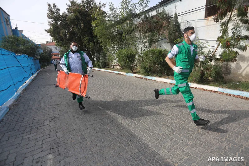 Palestinian Civil Defense members take part in a drill, in Gaza city, on December 4, 2016. Photo by Mohammed Asad