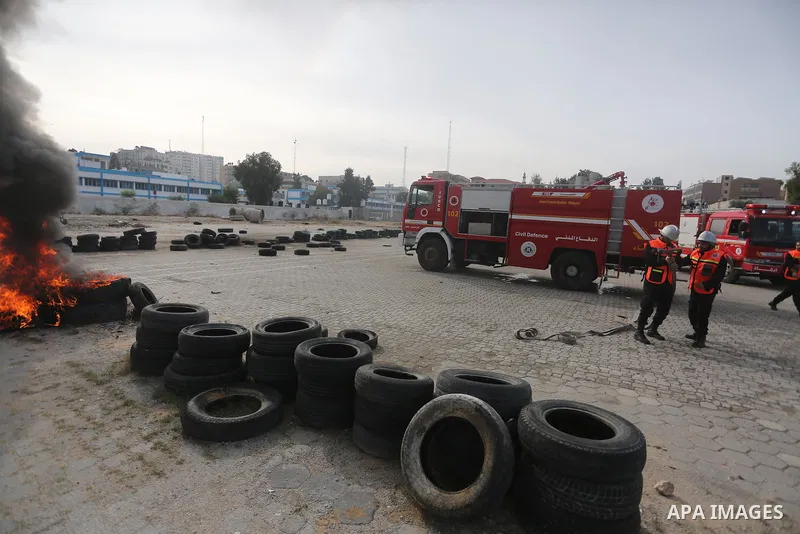 Palestinian Civil Defense members take part in a drill, in Gaza city, on December 4, 2016. Photo by Mohammed Asad