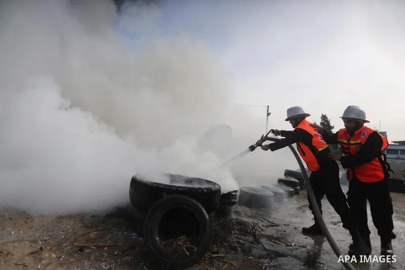 Palestinian Civil Defense members take part in a drill, in Gaza city, on December 4, 2016. Photo by Mohammed Asad