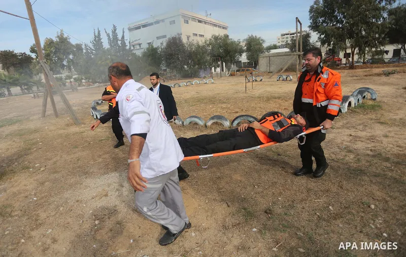 Palestinian Civil Defense members take part in a drill, in Gaza city, on December 4, 2016. Photo by Mohammed Asad