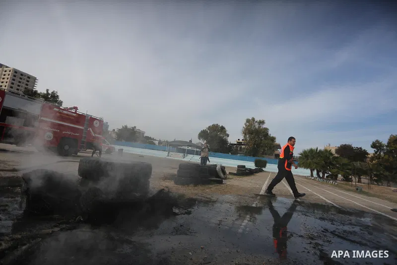 Palestinian Civil Defense members take part in a drill, in Gaza city, on December 4, 2016. Photo by Mohammed Asad
