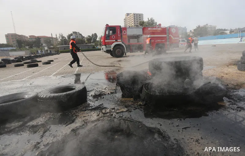 Palestinian Civil Defense members take part in a drill, in Gaza city, on December 4, 2016. Photo by Mohammed Asad