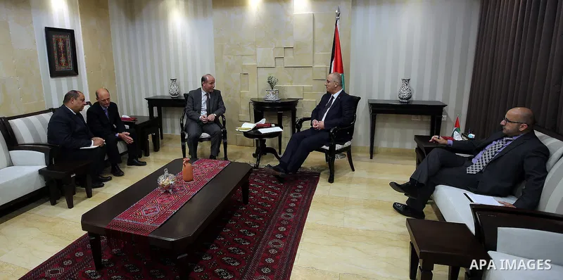 Palestinian Prime Minister Rami Hamdallah meets with director of the United Nations population fund in the Arab countries Loay Shabana, in the West Bank city of Ramallah, on December 4, 2016. Photo by Prime Minister Offi...
