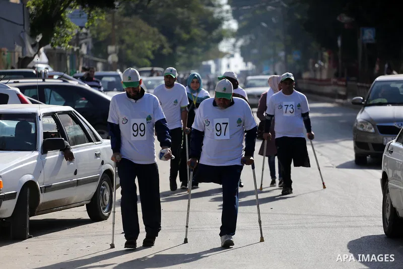 Palestinian disabilities to compete in a marathon marking the International Day of Persons with Disabilities in Gaza City on Dec. 05, 2016. Photo by Mohammed Asad
