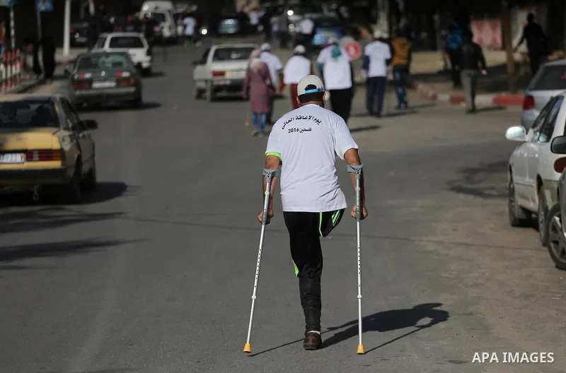 Palestinian disabilities to compete in a marathon marking the International Day of Persons with Disabilities in Gaza City on Dec. 05, 2016. Photo by Mohammed Asad