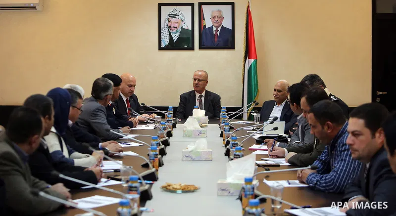 Palestinian Prime Minister, Rami Hamdallah, chairs a meeting of the Supreme Council of Civil Defence, in the Wet Bank city of Ramallah, on December 5, 2016. Photo by Prime Minister Office