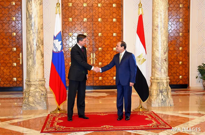 Egyptian President Abdel Fattah al-Sisi shake hands with Slovenian President Borut Pahor, before a meeting in Cairo, Egypt, on December 05, 2016. Photo by Egyptian President Office