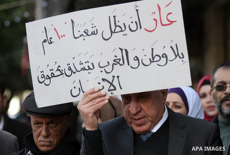 Palestinians hold banners during a campaign of 100 years on the Balfour Declaration, in the West Bank city of Nablus on December 6, 2016. The 1917 Balfour Declaration is a formal statement of policy by the British govern...