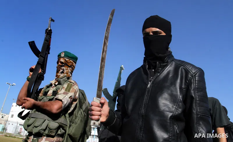 Palestinian youths loyal to the Hamas movement march during a rally in Khan Yunis in the southern Gaza Strip, December 8, 2016. Photo by Abed Rahim Khatib