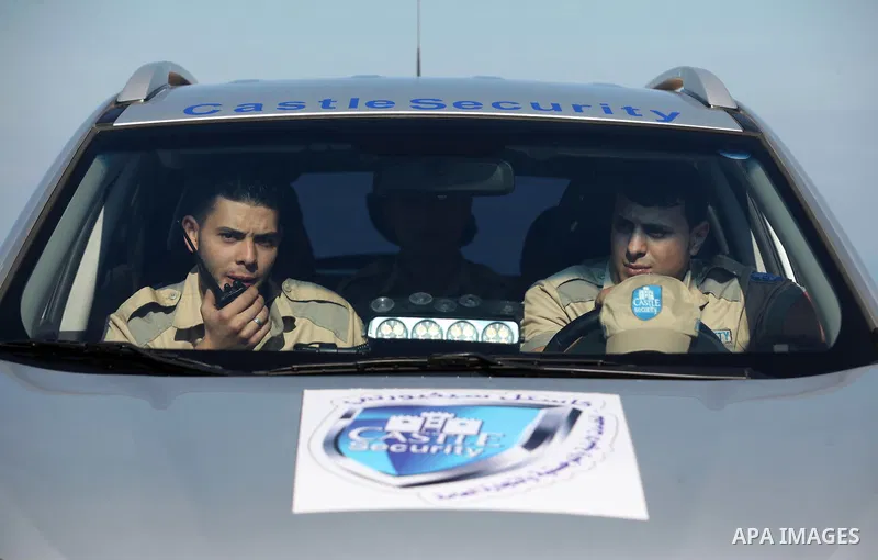 Palestinian private security guards from Castle Security company take part in an exercise during a simulation on how to secure important characters, in Gaza City on December 08, 2016. Photo by Ashraf Amra