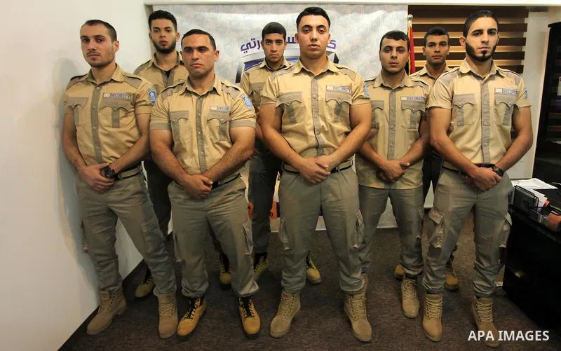Palestinian private security guards from Castle Security company take part in a work day in Gaza City on December 08, 2016. Photo by Ashraf Amra