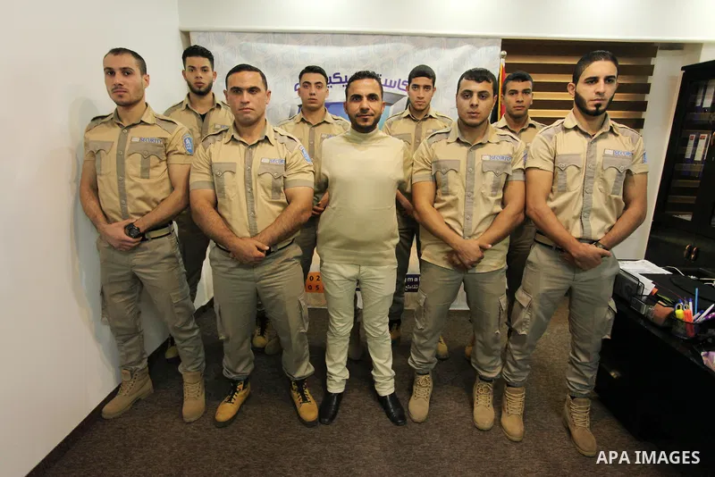 Palestinian private security guards from Castle Security company take part in a work day in Gaza City on December 08, 2016. Photo by Ashraf Amra