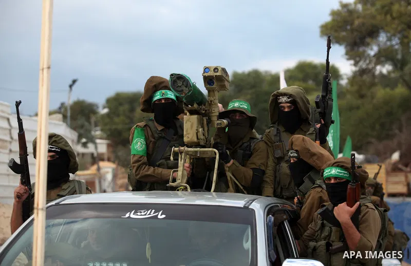 Members of the Ezzedine al-Qassam Brigades, the military wing of the Palestinian Islamist movement Hamas, take part in a rally marking the 29th anniversary of Hamas foundation, in Jabalia in the northern of Gaza Strip, o...