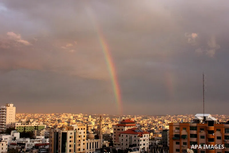 A rainbow appears over Gaza city after rain during the sunset on December 08, 2016. Photo by Stranger