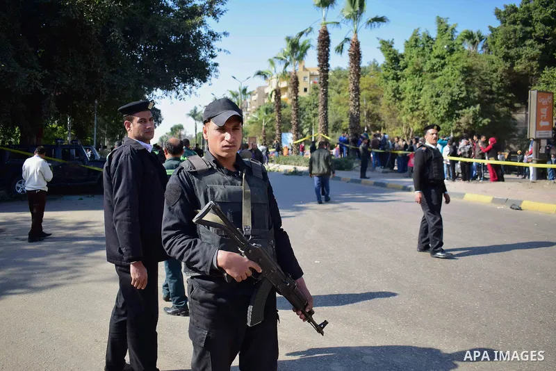 Egyptian special police officers stand guard at the scene of a bomb blast in Giza Al Haram Street on the outskirts of Cairo, Egypt December 9, 2016. Photo by Amr Sayed