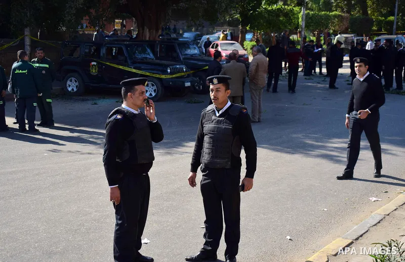 Egyptian special police officers stand guard at the scene of a bomb blast in Giza Al Haram Street on the outskirts of Cairo, Egypt December 9, 2016. Photo by Amr Sayed